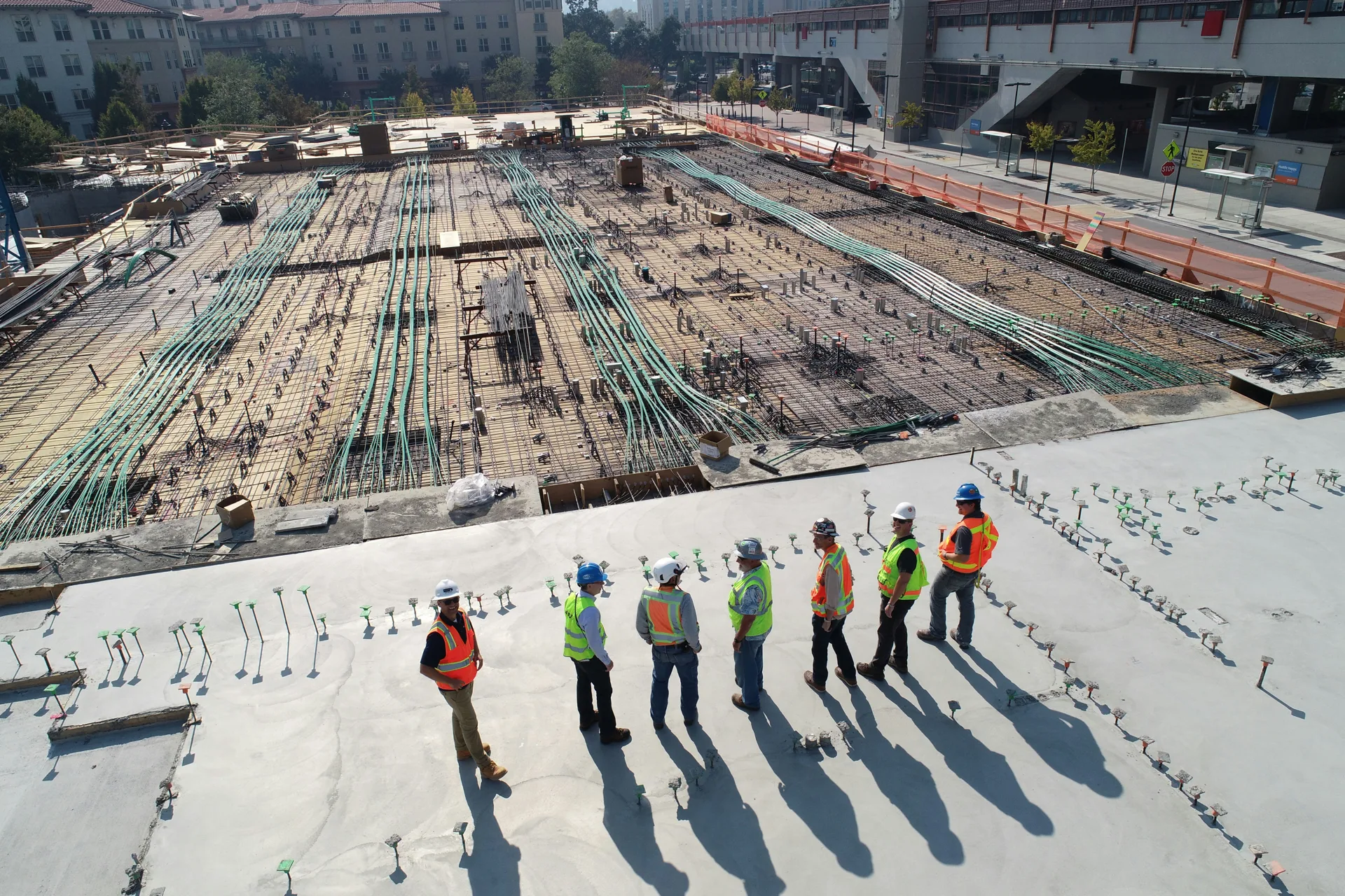 concrete pour in progress, the kind of work the cost guide ranges describe
