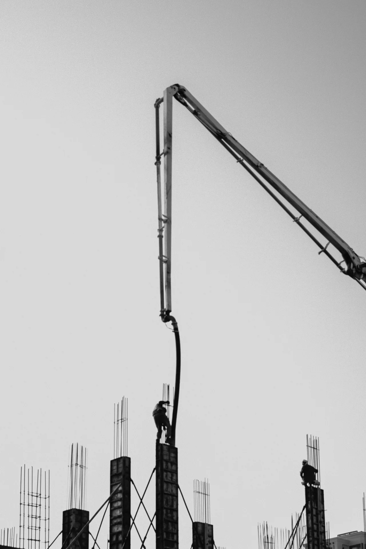 concrete pump and rebar on a tilt-up construction site in Minneapolis
