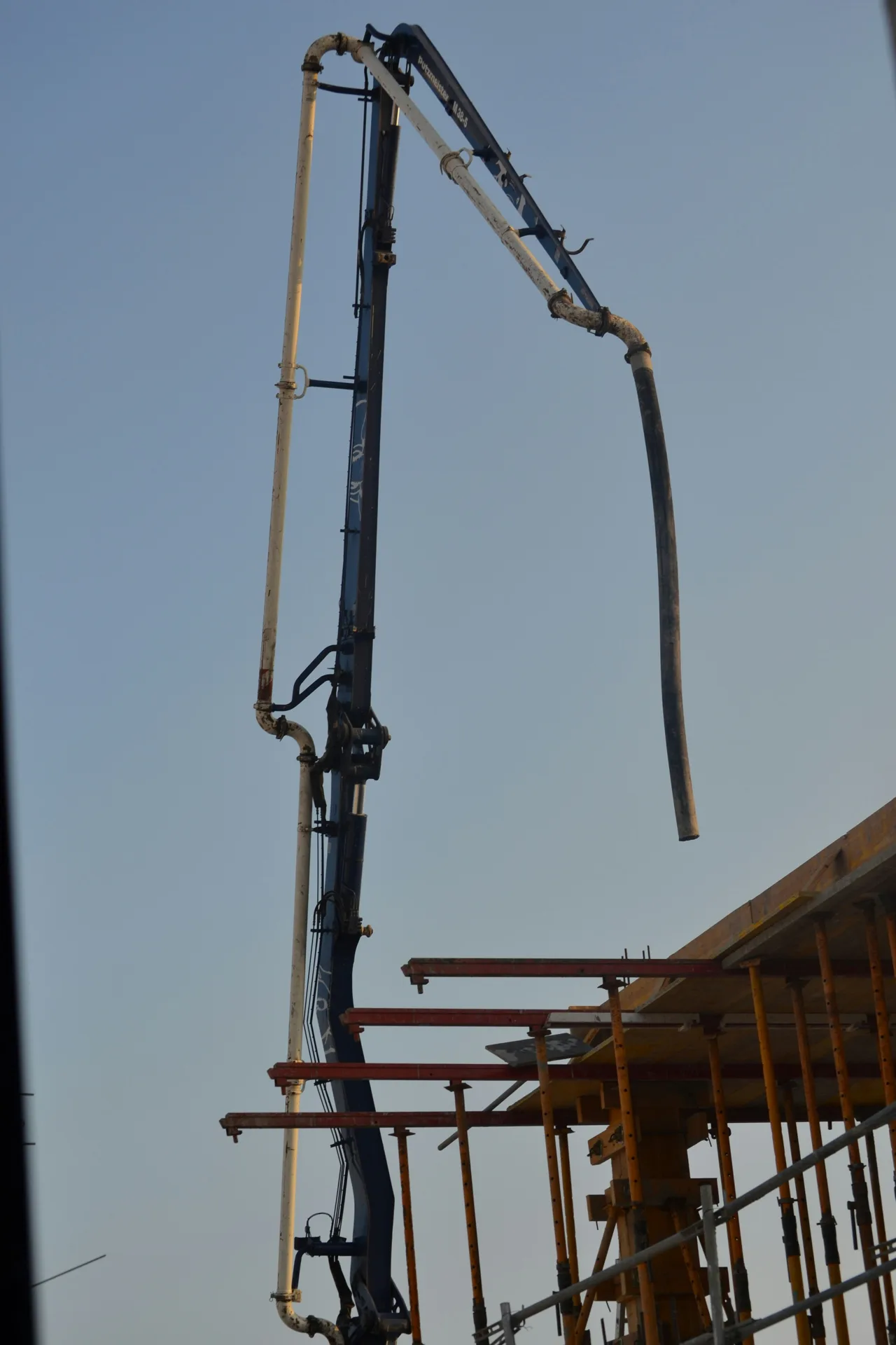 pump operator working with contractor's placement crew