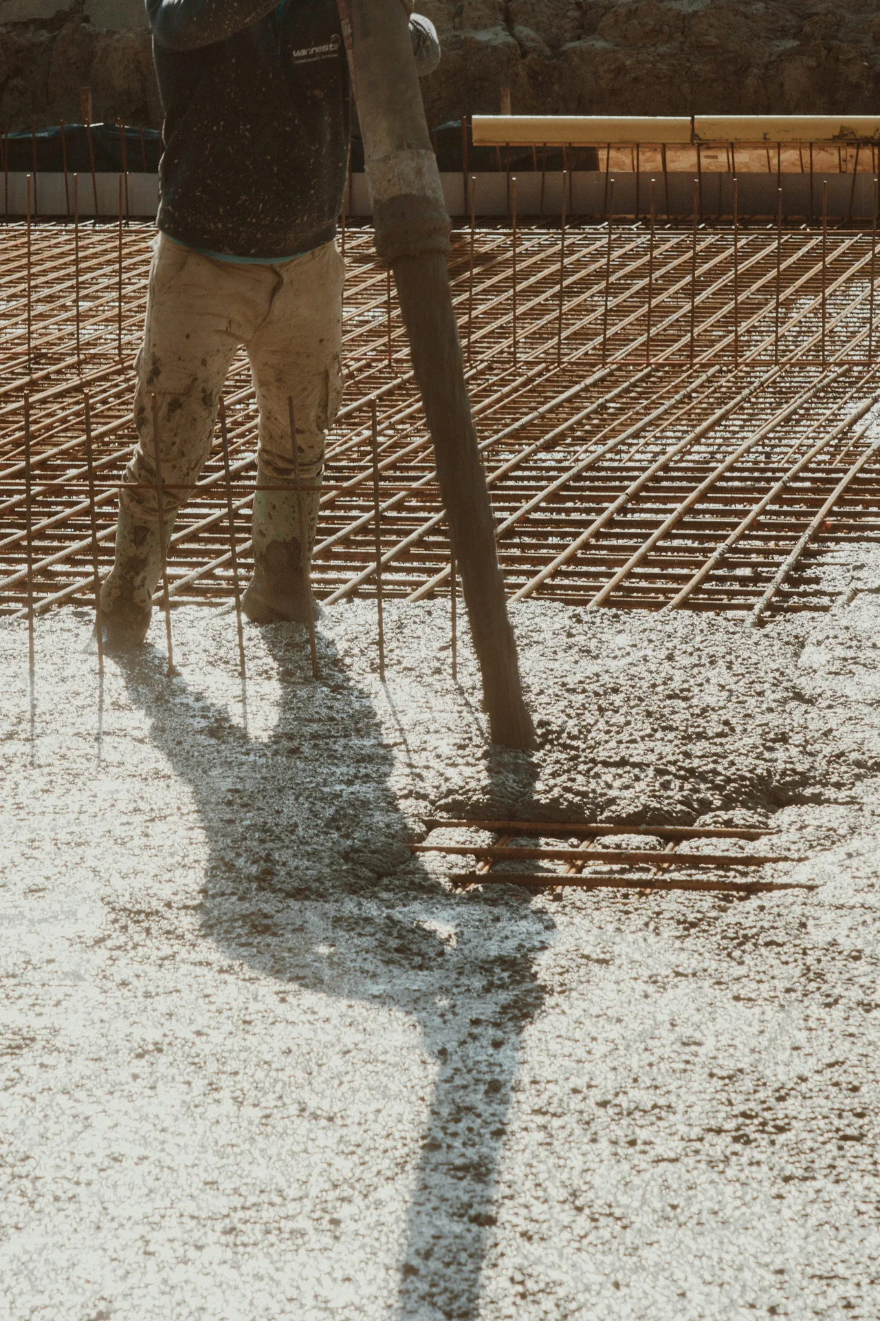 concrete pump hose placing concrete over a Minneapolis rebar mat
