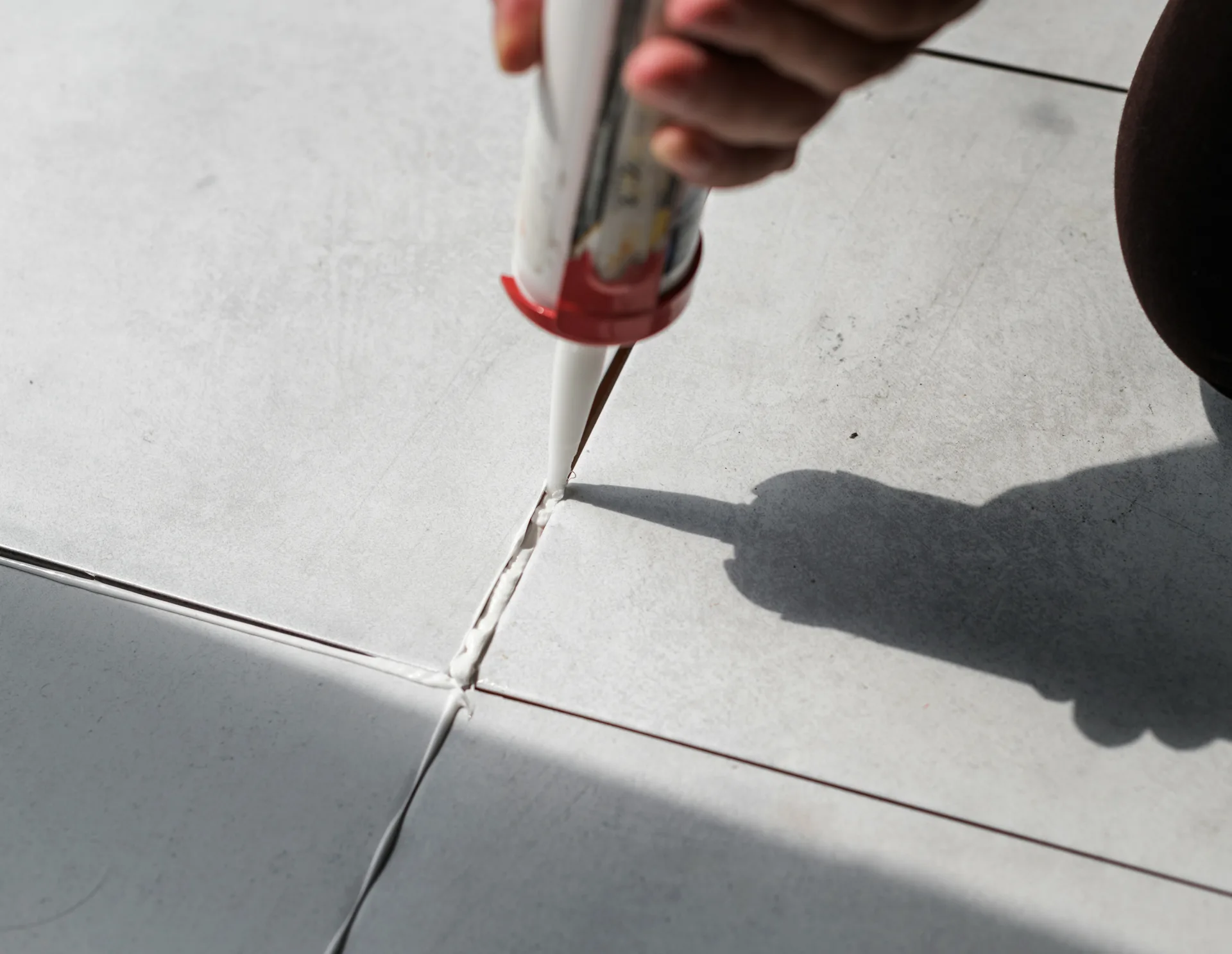 semi-rigid polyurea joint filler being applied to a warehouse control joint
