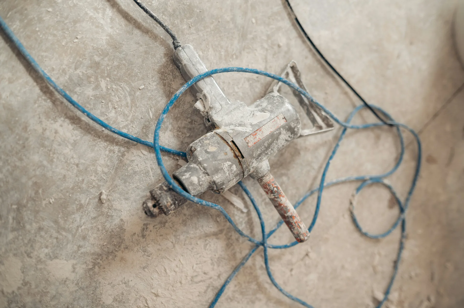 jackhammer removing a failed section of concrete for repair in Minneapolis