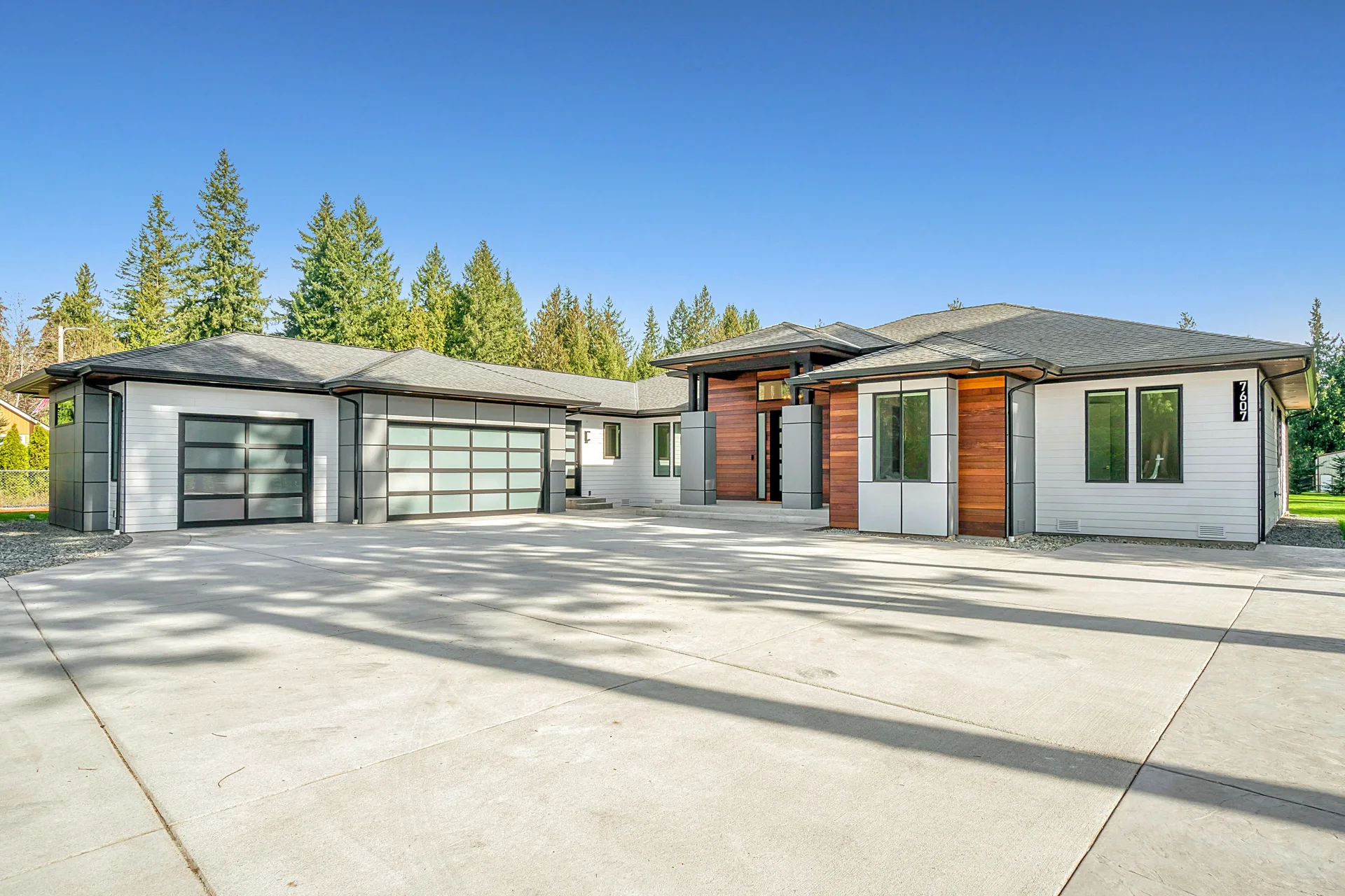 new concrete driveway at a modern three-car-garage Minneapolis home