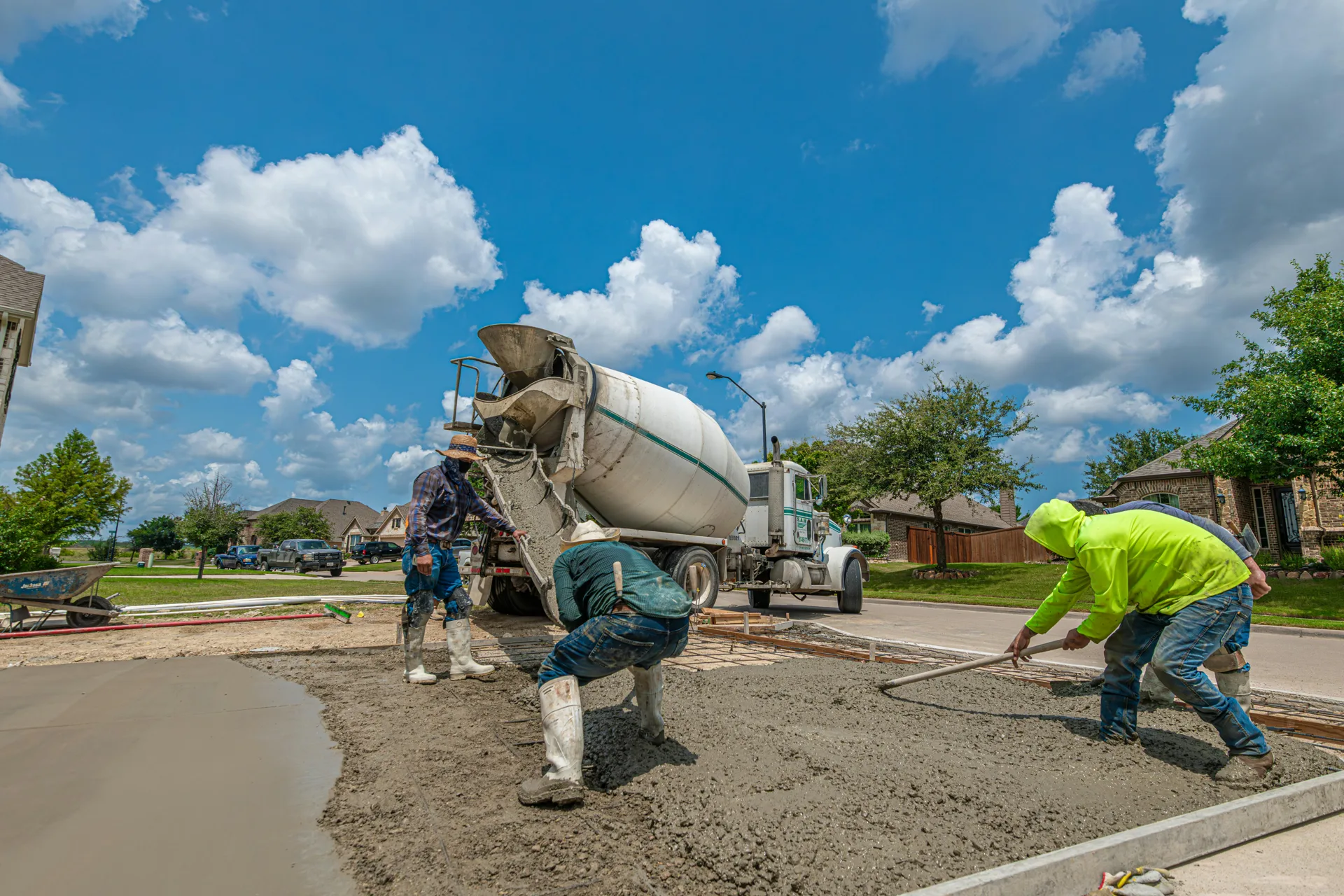 Minneapolis concrete crew finishing a fresh driveway pour