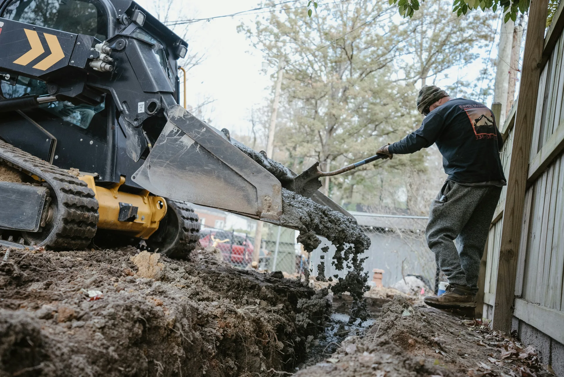 concrete foundation footing pour with a skid steer at a Minneapolis site
