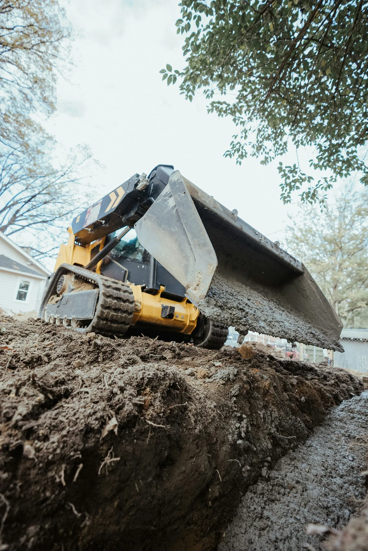 foundation repair pour with a track loader in Minneapolis