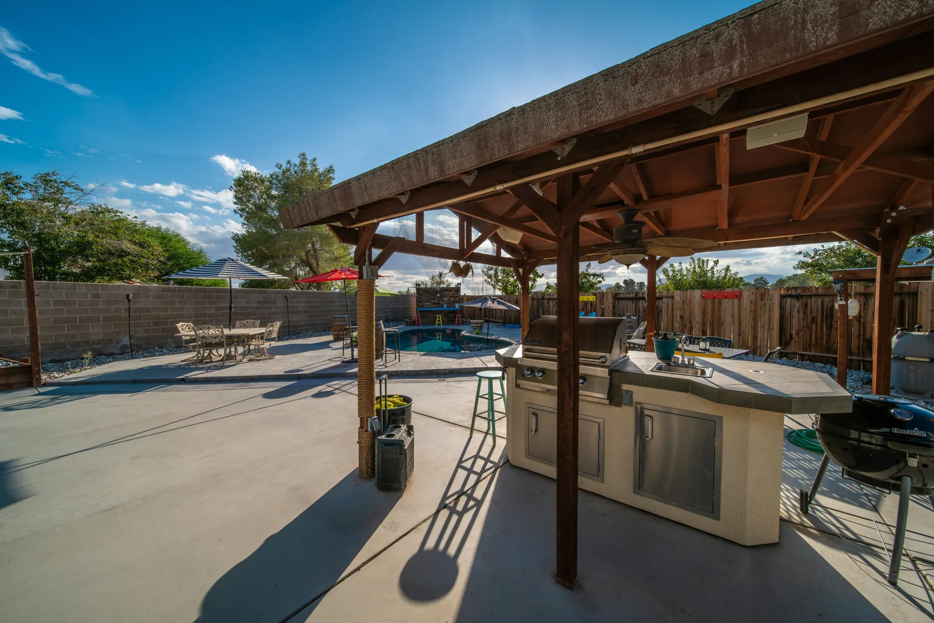 broom-finish concrete pad around a fire pit at a Minneapolis home