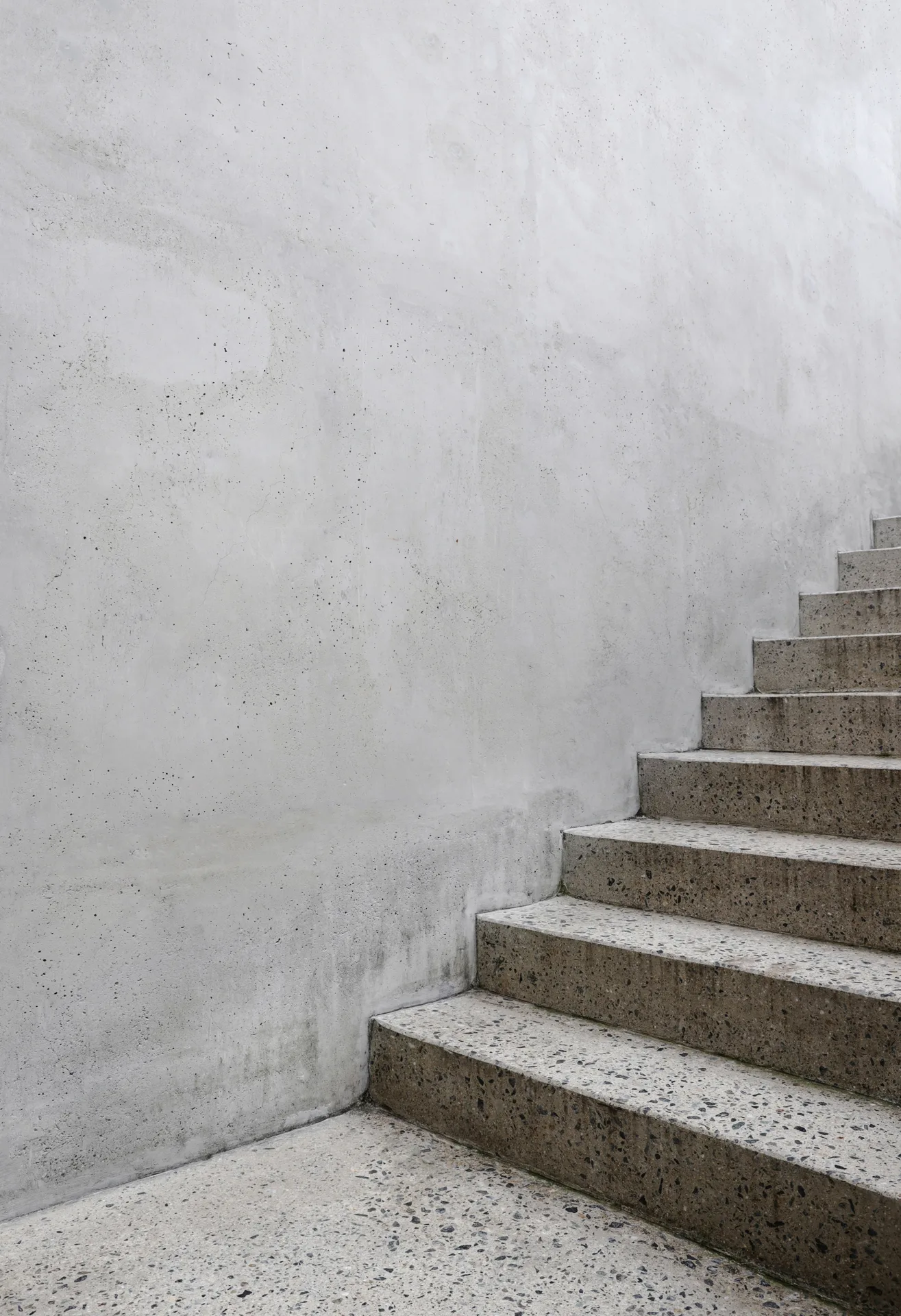 finished concrete front entry steps at a Minneapolis home in winter