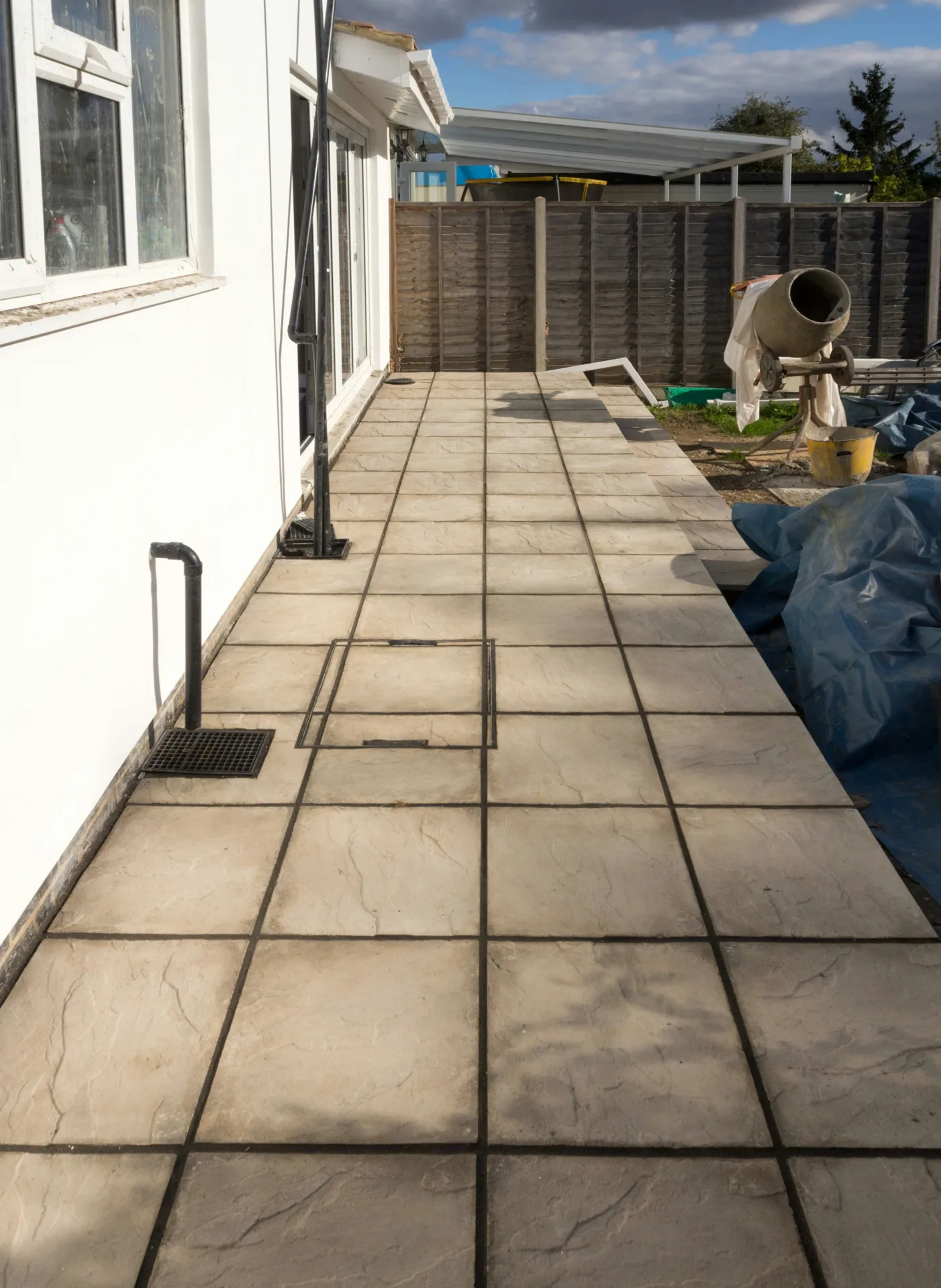 concrete walkway installation along the side yard of a Minneapolis home